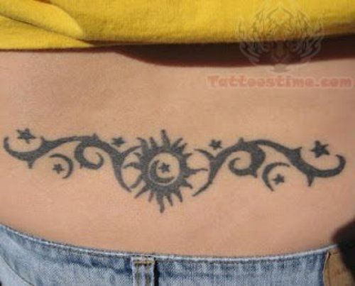 Tribal And Sun Lower Back Tattoo